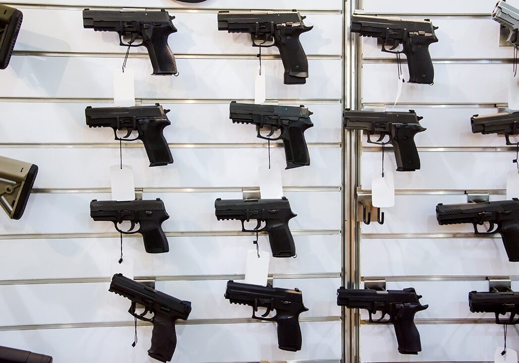 Pistols on Wall Rack at Gun Store